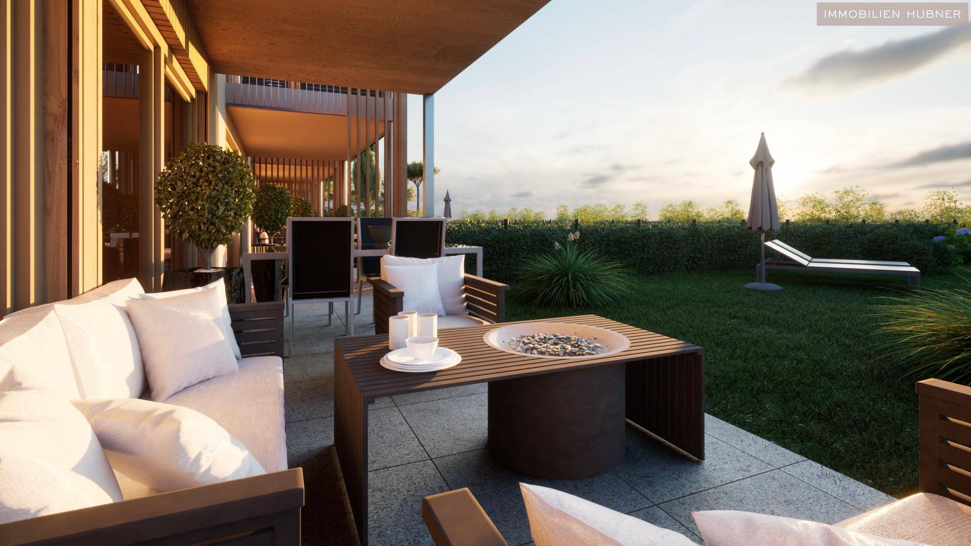 Gemütliche Terrasse mit Sitzgelegenheiten und Feuerstelle, ideal für entspannte Abende im Freien.