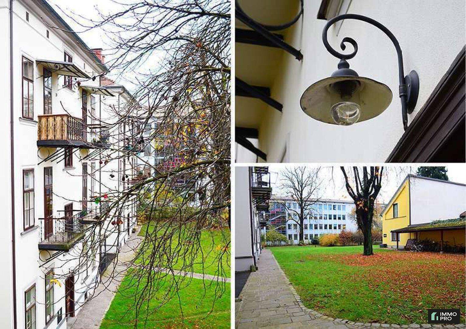 Gepflegter Gartenbereich mit Bäumen, Gehwegen und einer klassischen Außenleuchte am Gebäude.