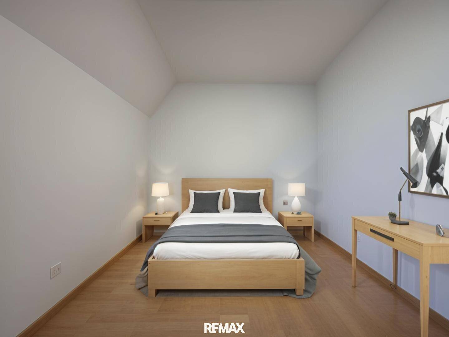 Modern eingerichtetes Schlafzimmer mit Holzbett, Schreibtisch und Dachschräge.