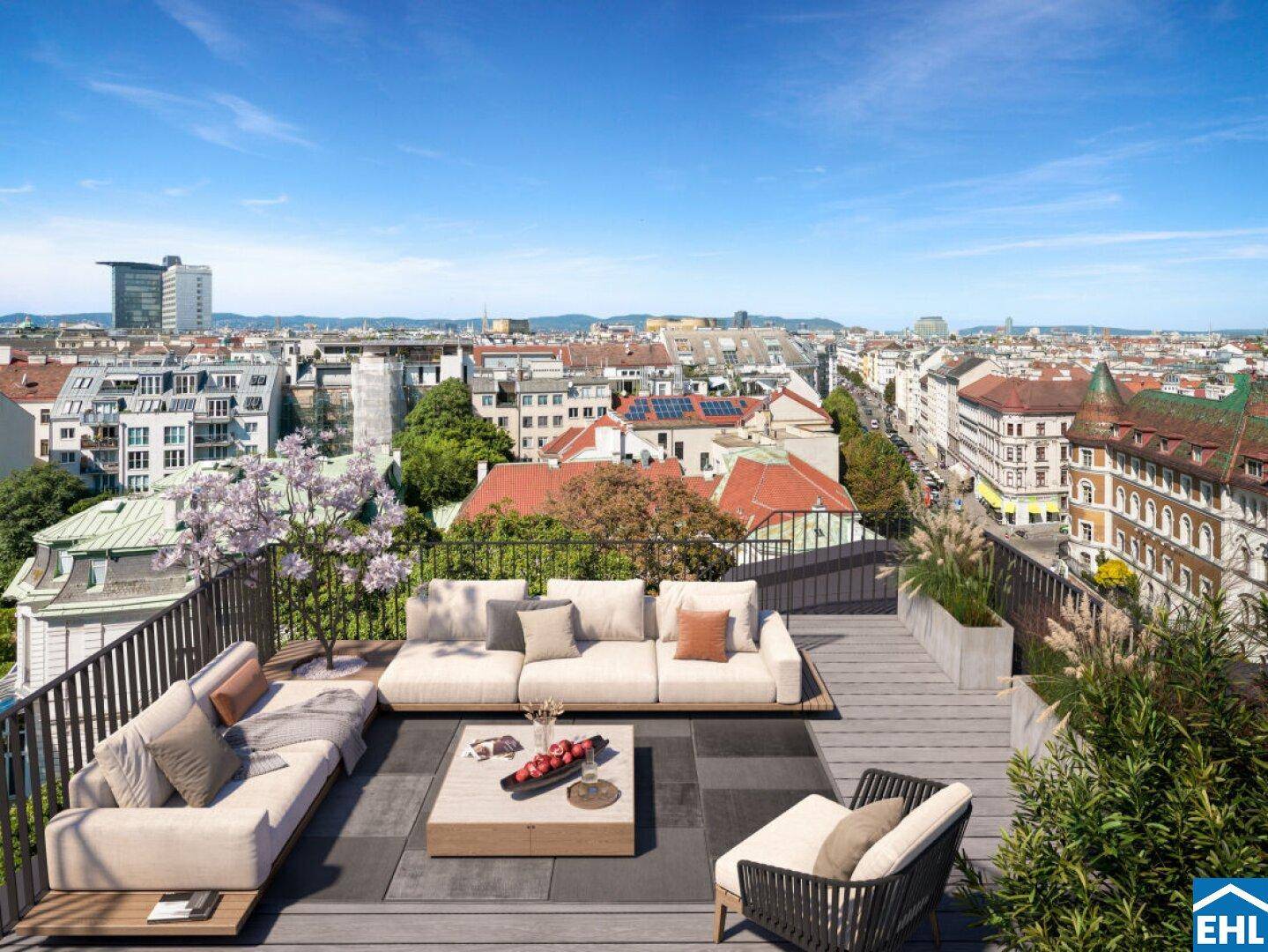 Großzügige Dachterrasse mit Lounge-Möbeln und Panoramablick über die Stadt.