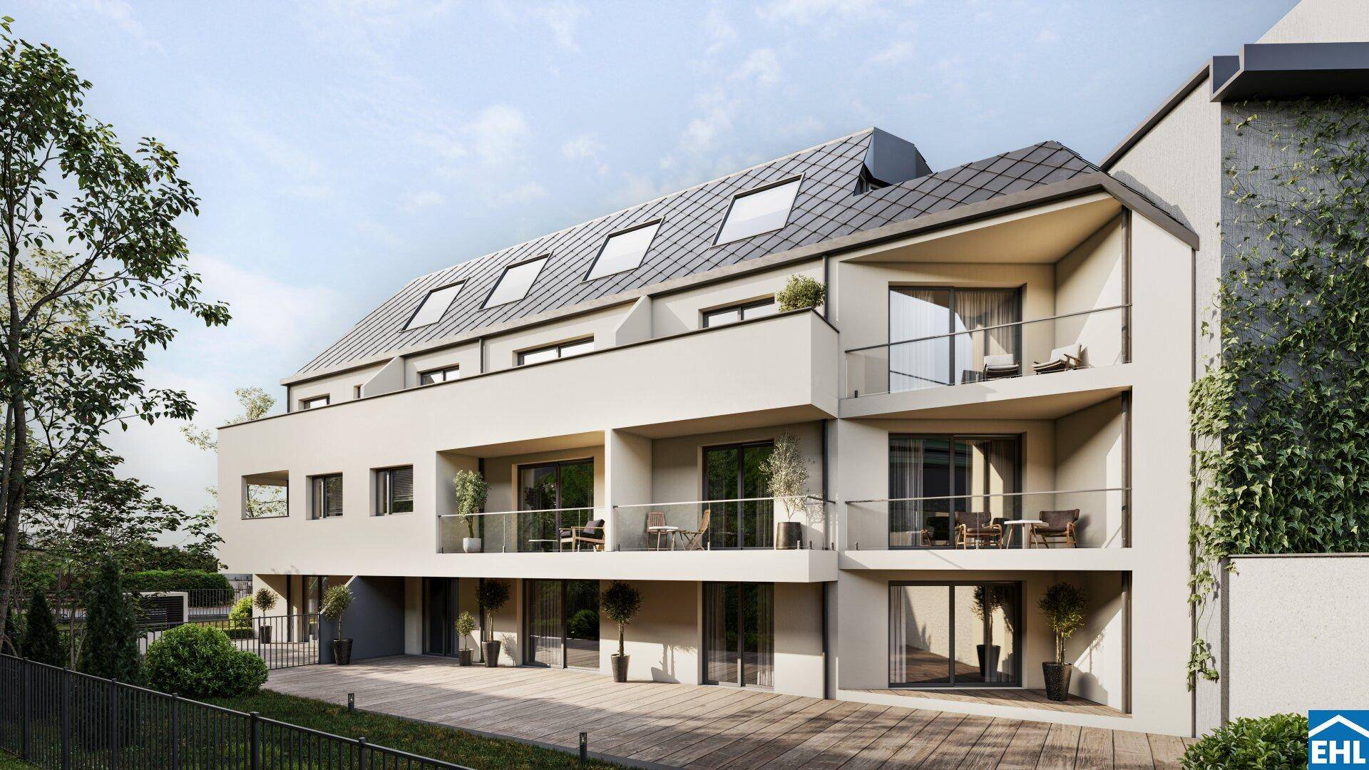 Ansicht eines modernen Mehrfamilienhauses mit mehreren Balkonen und großen Glasfronten.