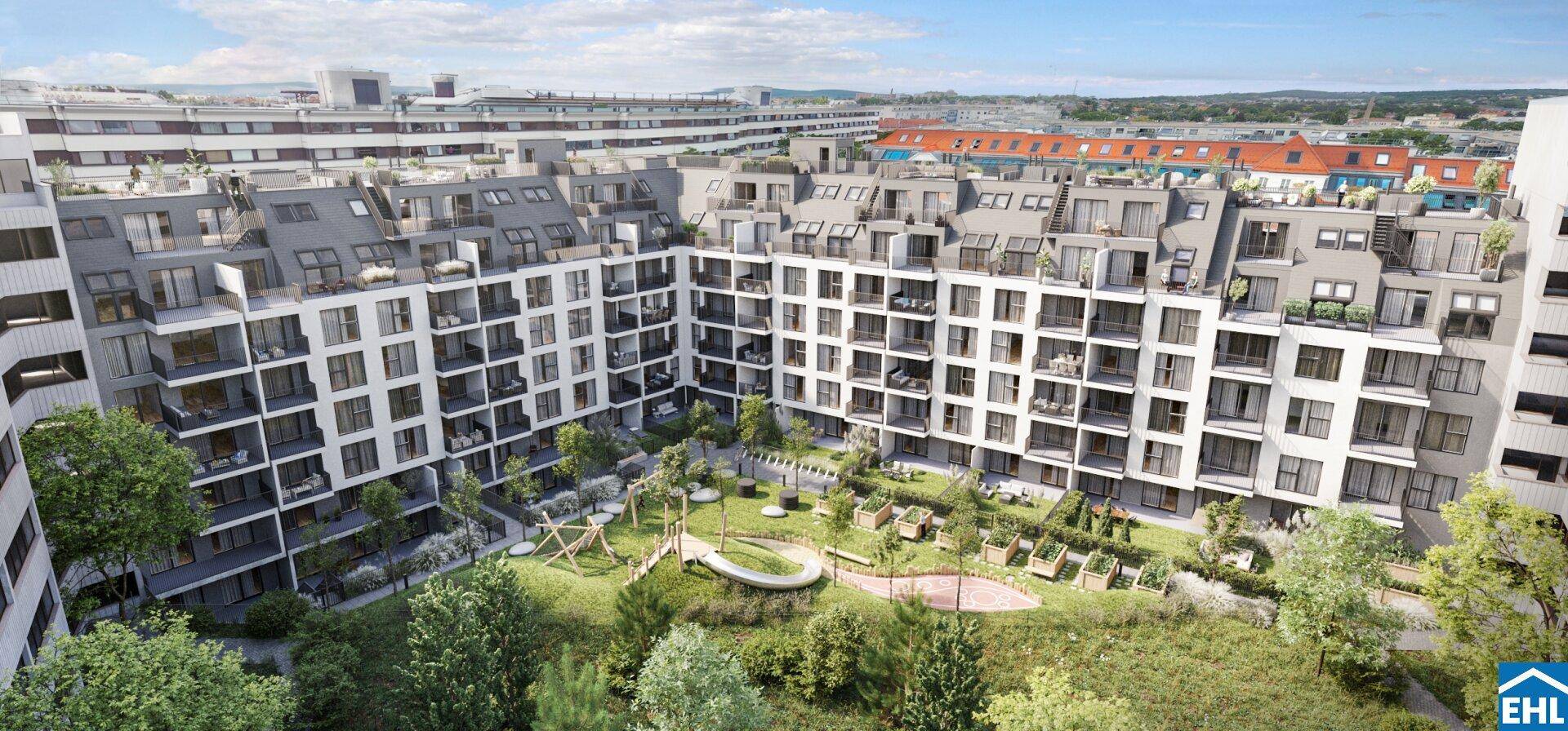 Moderne Wohnanlage mit weiß-grauer Fassade, Balkonen und einem grünen Innenhof mit Spielplatz.