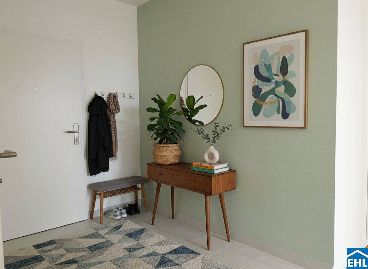 Eingangsbereich mit moderner Einrichtung, grün gestrichener Wand und Fliesenboden.