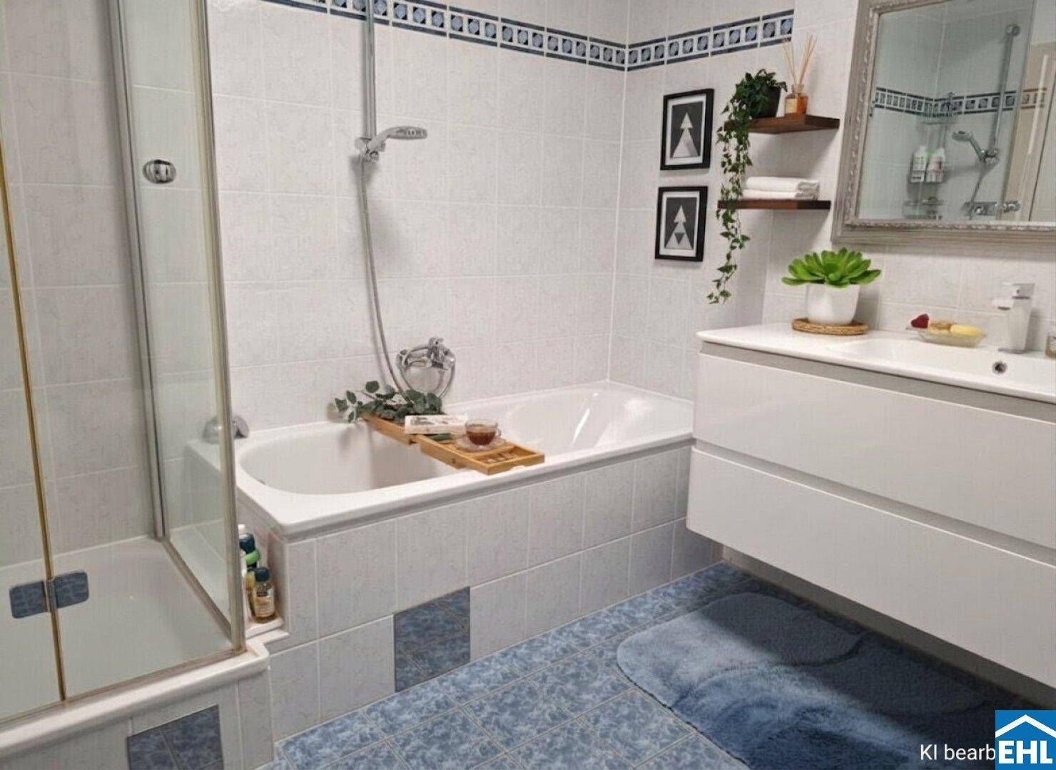 Badezimmer mit Badewanne, Duschkabine und modernem Waschtisch.