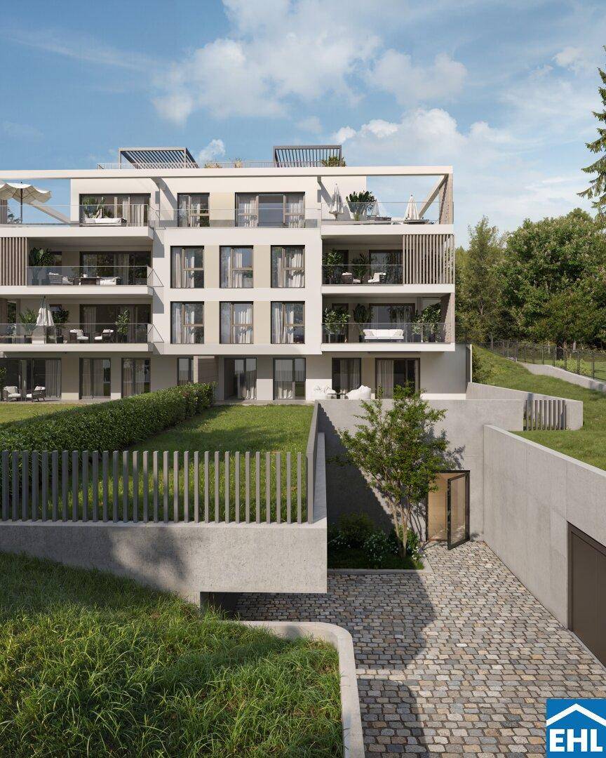 Außenansicht des modernen Gebäudes mit privaten Gärten und Zugang zur Tiefgarage.