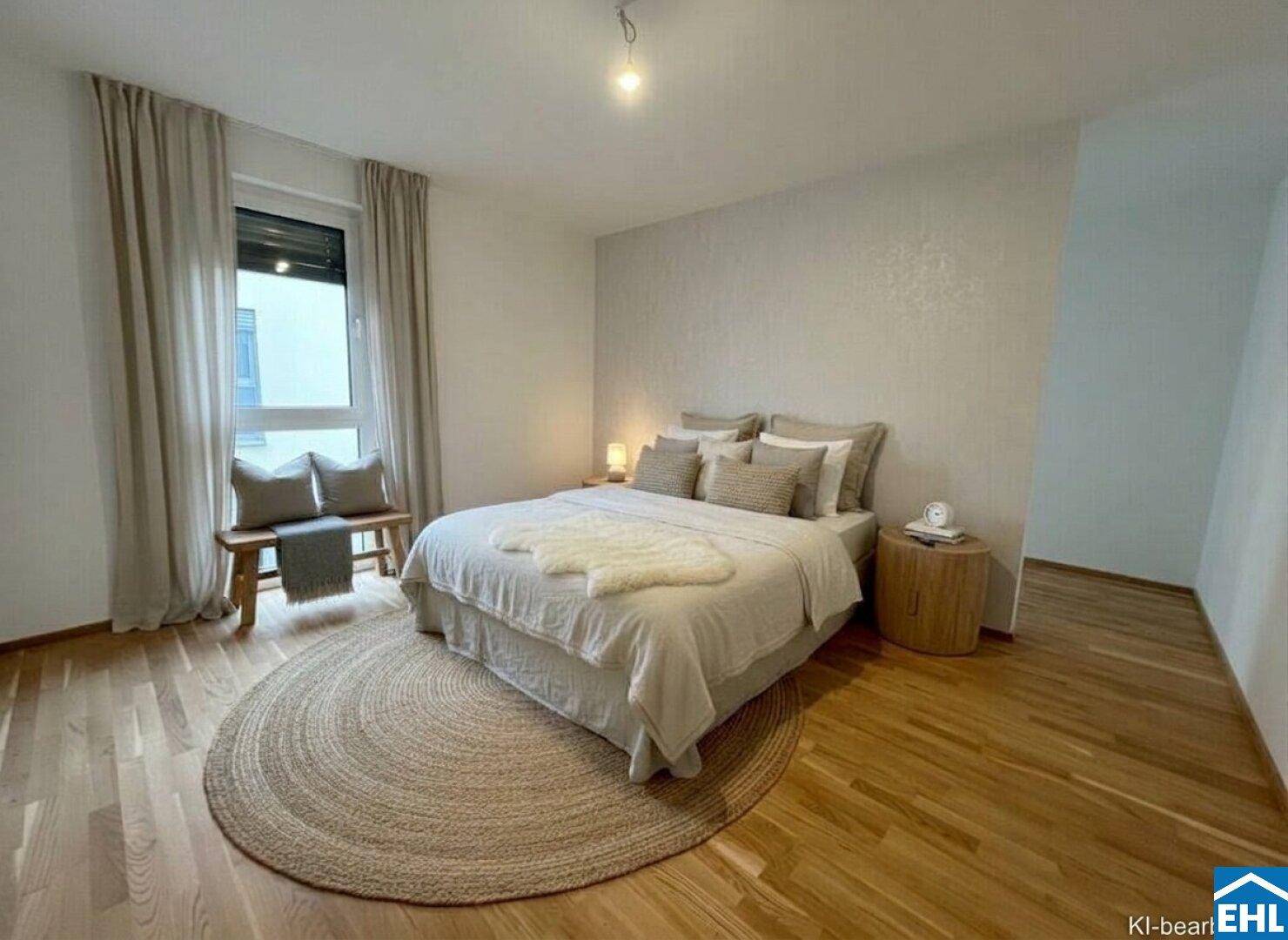 Modern eingerichtetes Schlafzimmer mit Holzboden und runder Jute-Teppich, sehr gemütlich.
