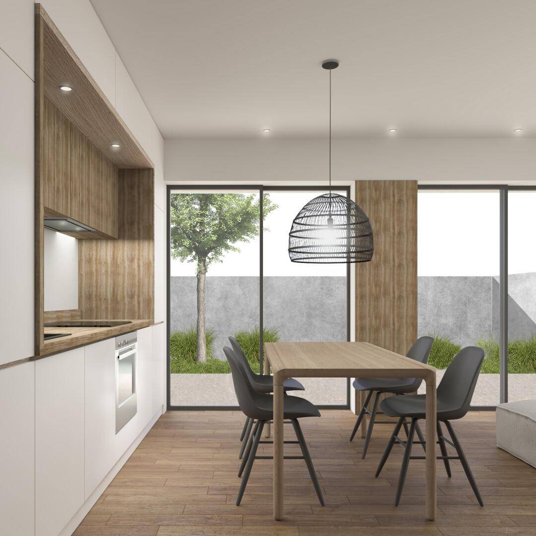 Moderne Küche mit Essbereich, Holzakzenten und Zugang zu einem kleinen Gartenbereich.