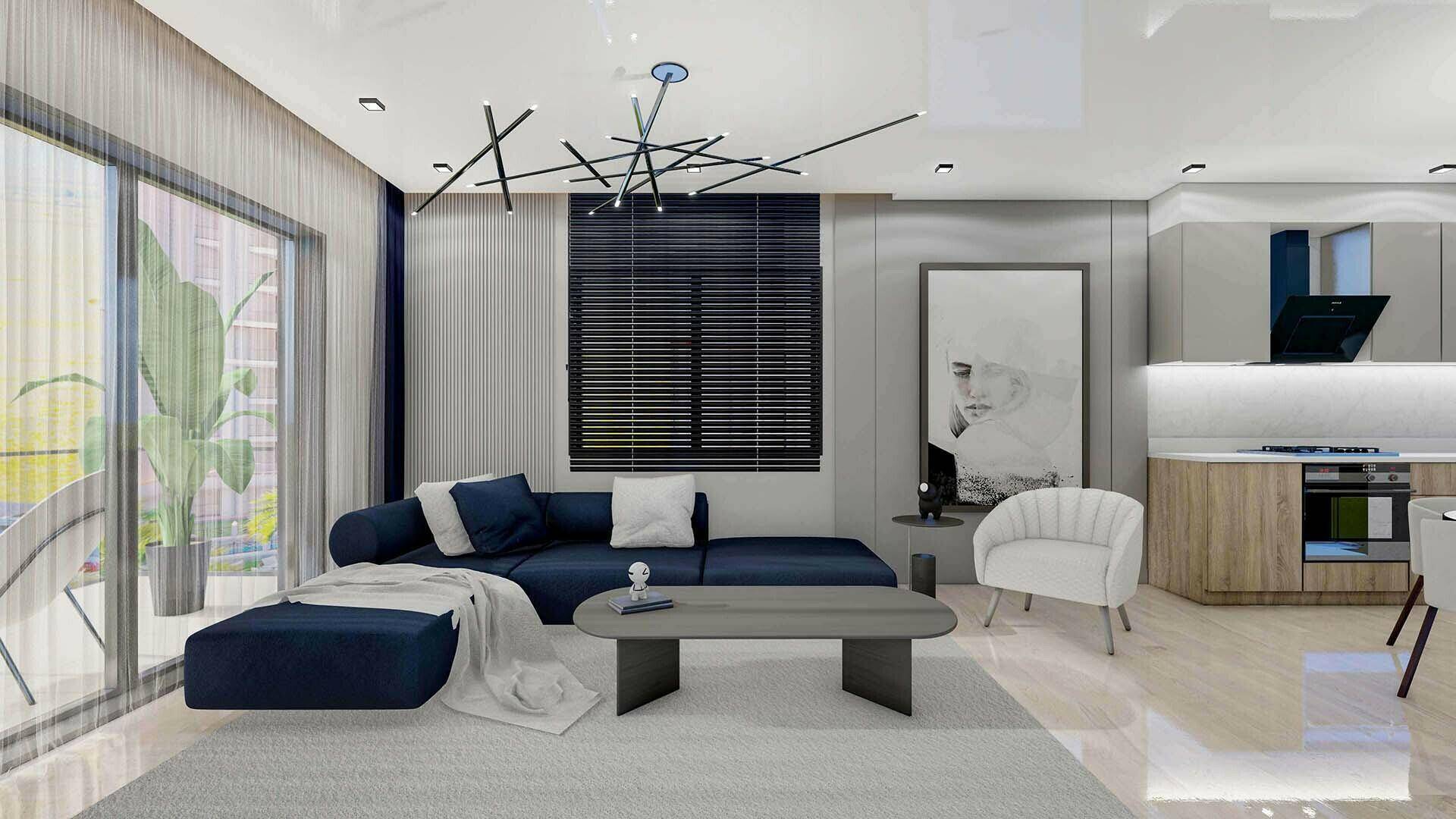 Modernes Wohnzimmer mit dunkelblauem Sofa, großem Fenster und integrierter Küchenzeile.