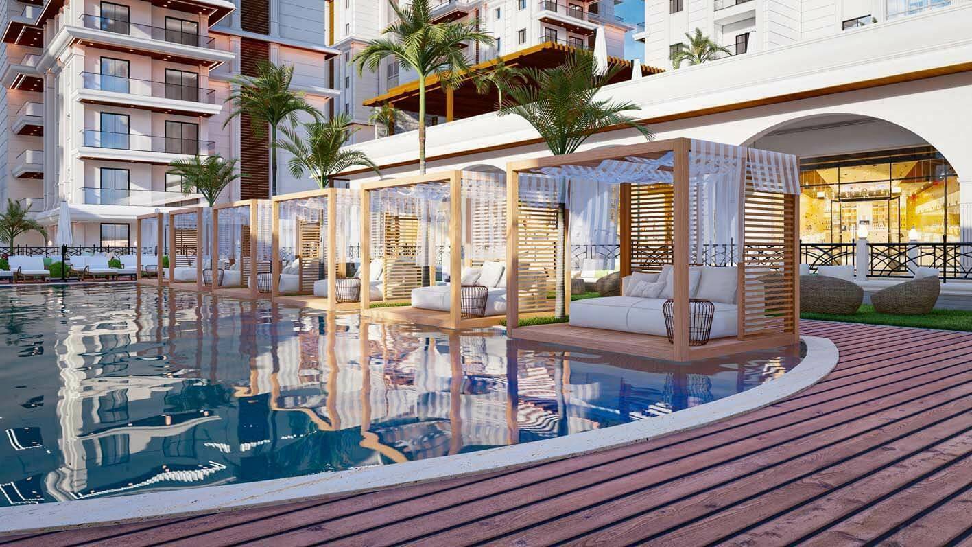 Luxuriöser Poolbereich mit eleganten Cabanas und Liegemöglichkeiten für entspannte Stunden.
