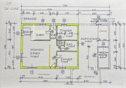 Grundriss einer Wohnung mit Wohn-Essbereich, Küche, zwei Zimmern und Terrasse.