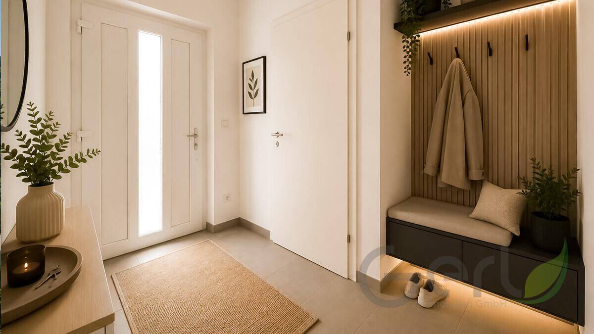 Heller Eingangsbereich mit moderner Garderobe, Sitzbank und indirekter Beleuchtung.