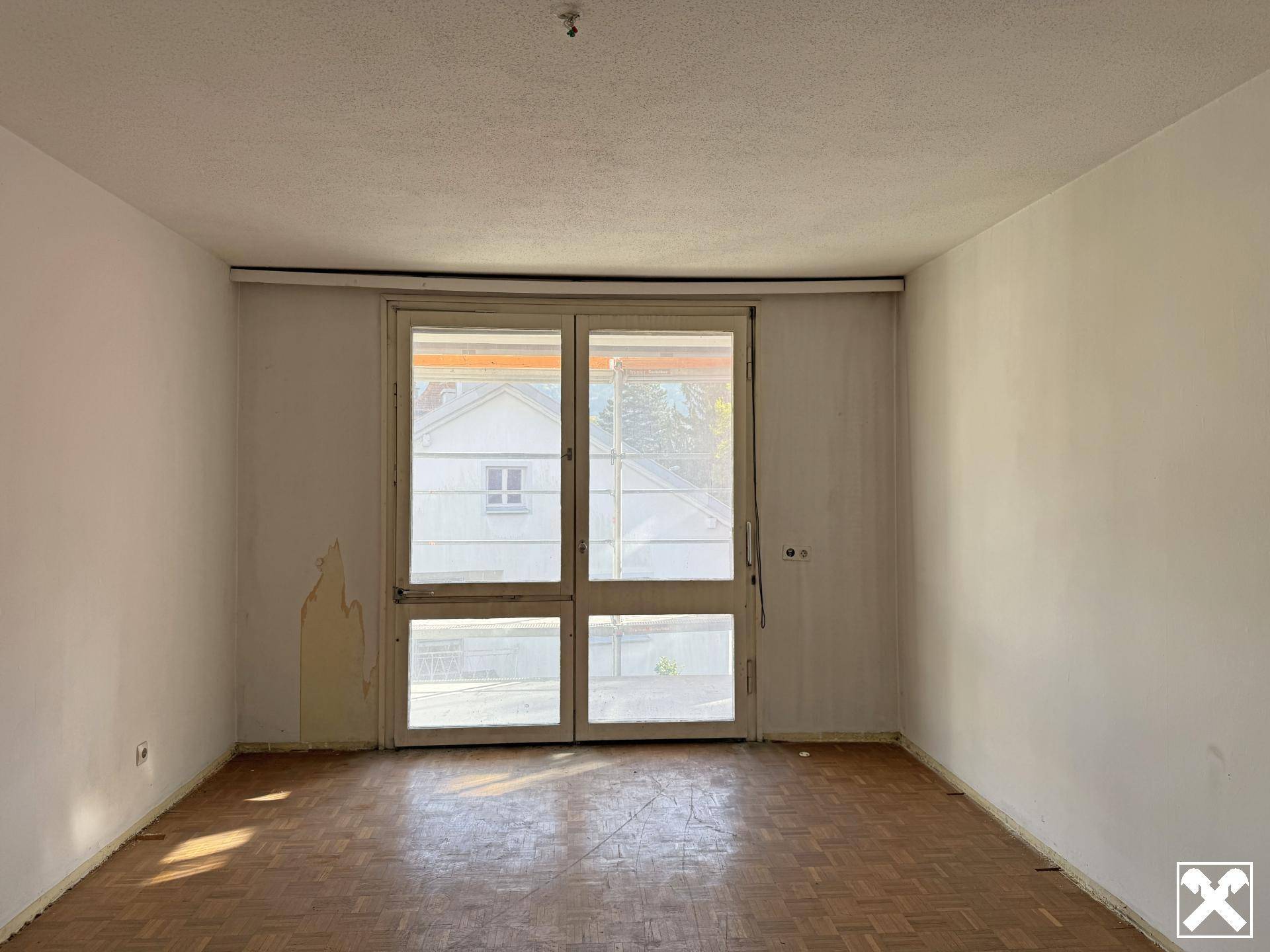 Schlafzimmer mit Zugang auf den Balkon