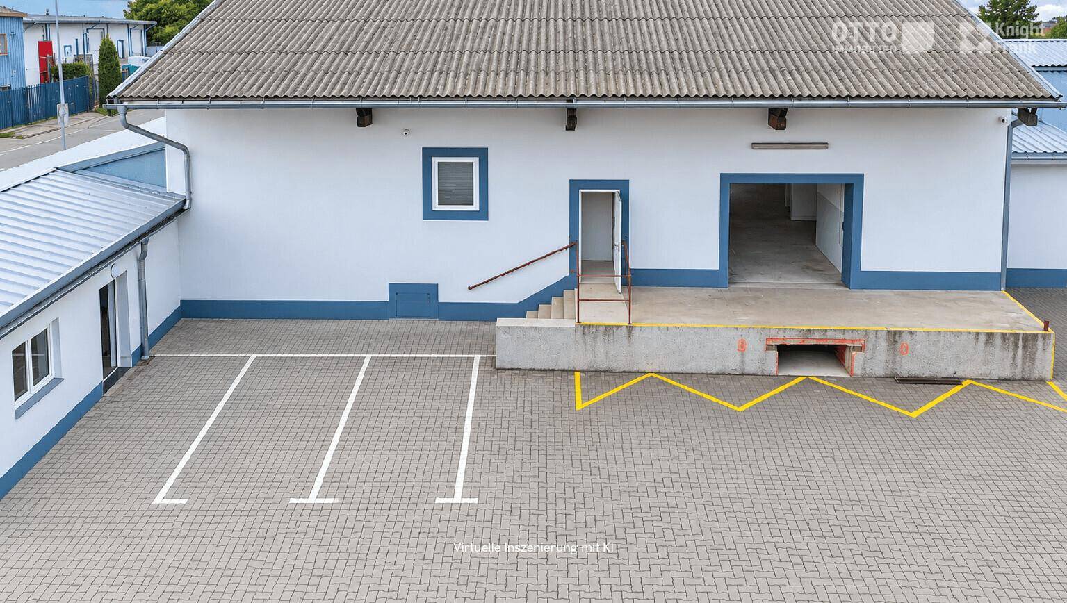Draufsicht auf das Lagergebäude mit Laderampe, Parkplätzen und umliegender Bebauung.