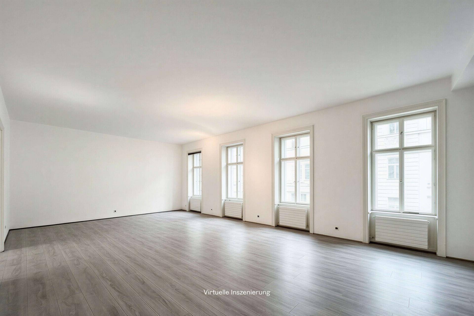 Geräumiger, leerer Raum mit vielen Fenstern und hellem Laminatboden, ideal für flexible Büronutzung.