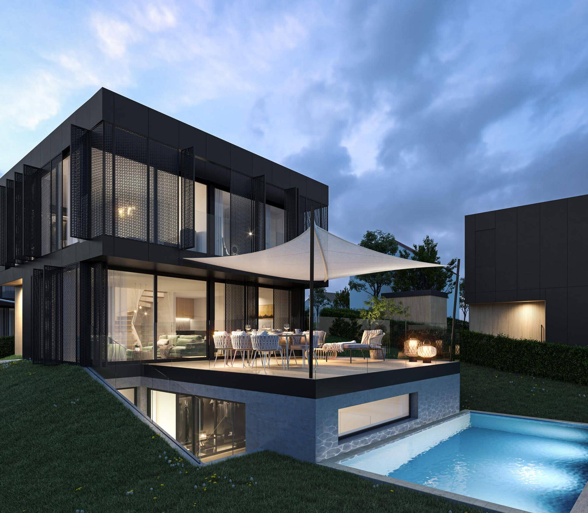 Abendliche Ansicht einer modernen Villa mit beleuchteter Terrasse, Essbereich und Pool.