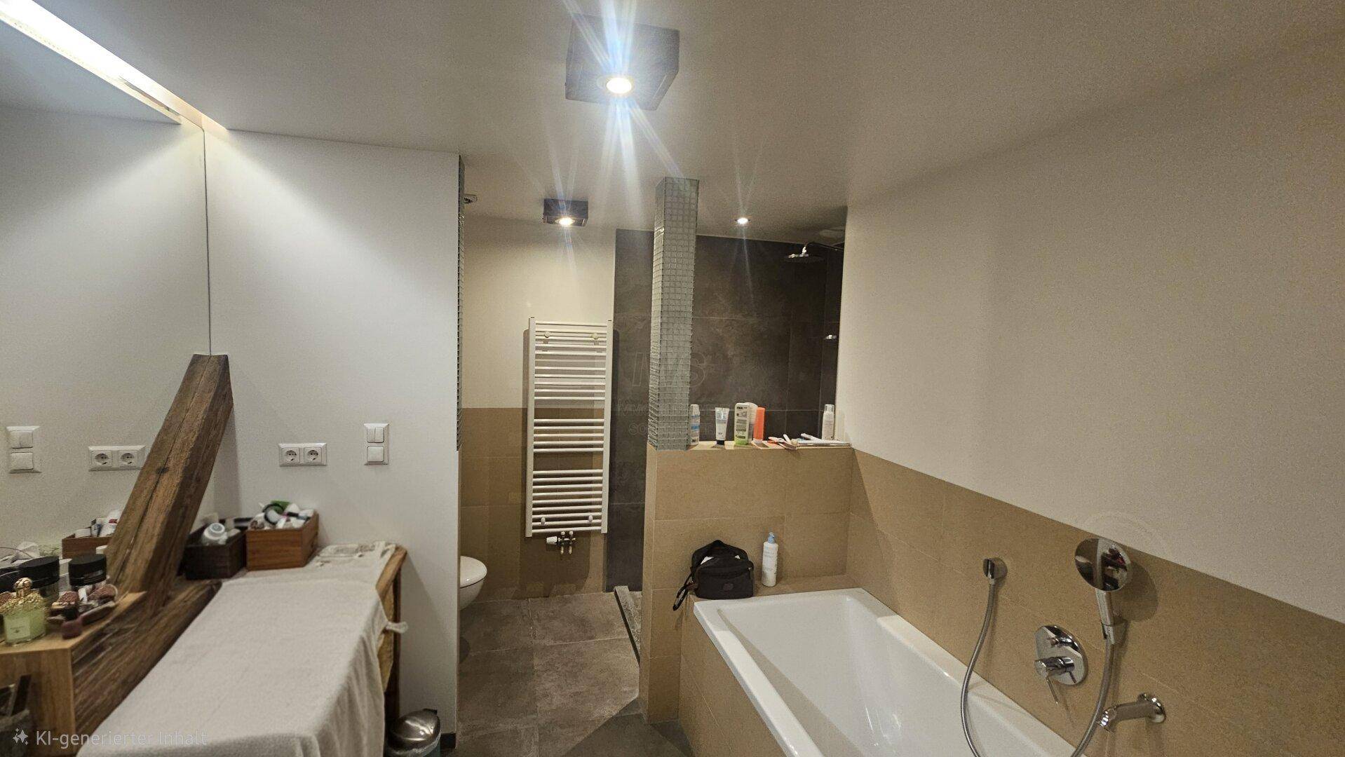 Geräumiges Badezimmer mit Badewanne, Dusche, WC und beheiztem Handtuchhalter.