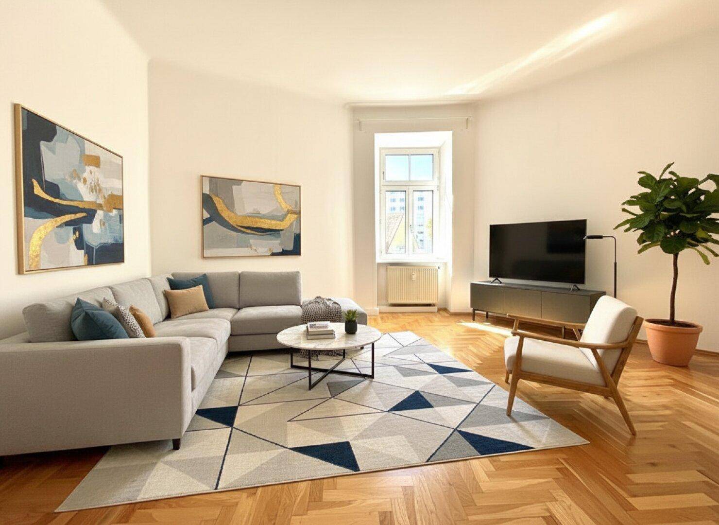 Helles Wohnzimmer mit Ecksofa, Parkettboden und modernem Teppichmuster.