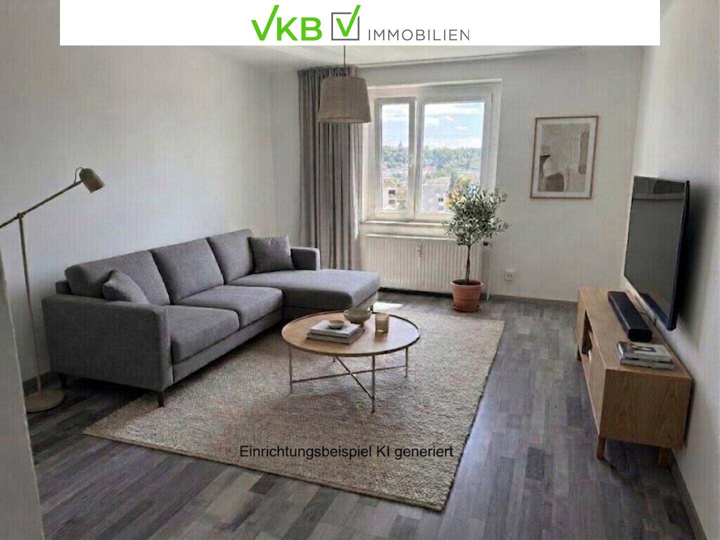 Modern eingerichtetes Wohnzimmer mit grauem Laminatboden und bequemer Couch.
