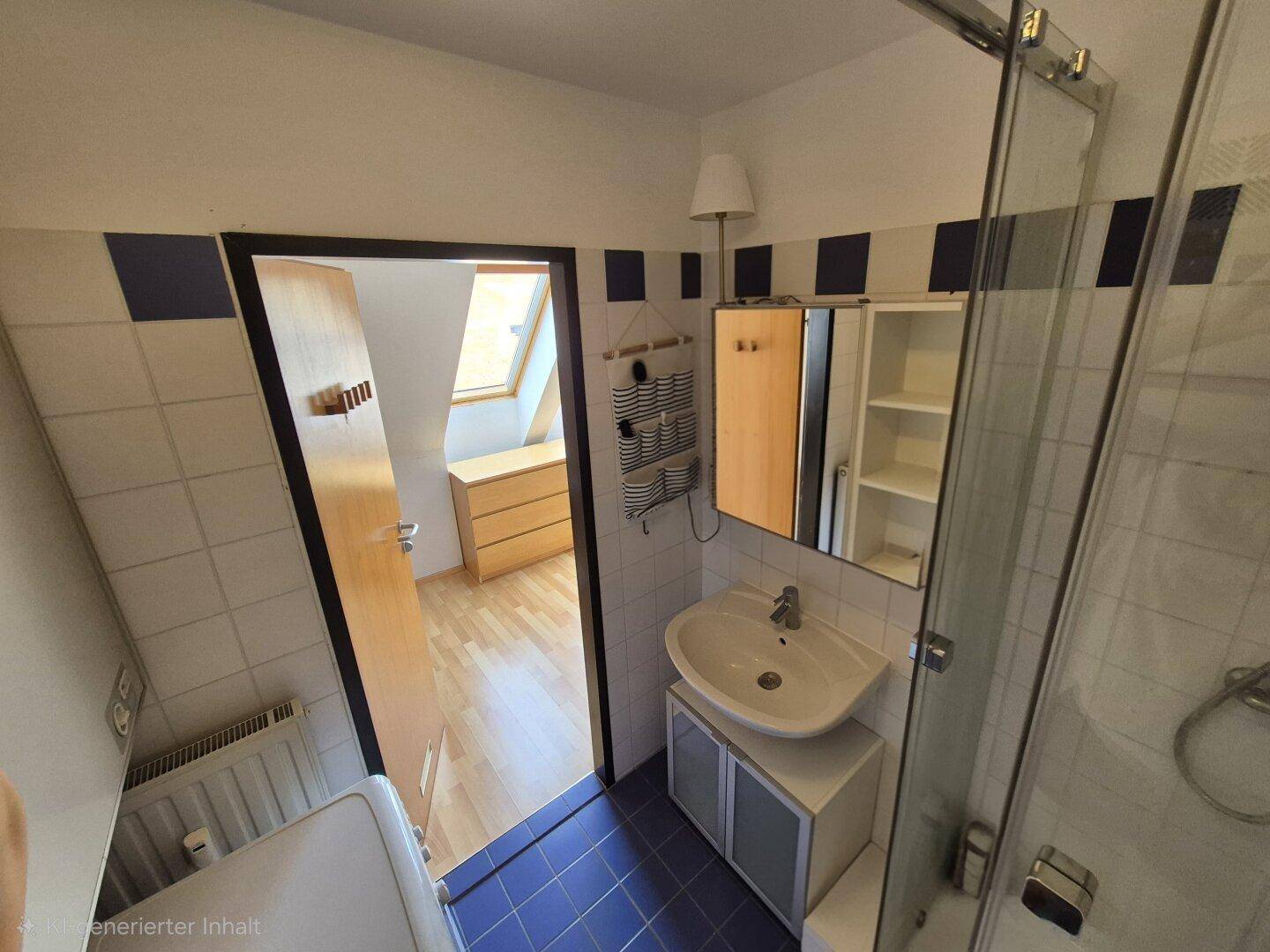 Badezimmer mit Dusche, Waschbecken und blauen Akzentfliesen, funktional und sauber.