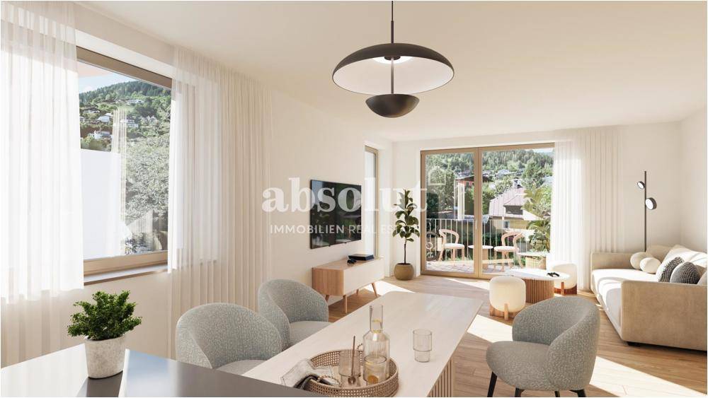 Helles, offenes Wohn-Esszimmer mit modernem Design, Holzboden und Zugang zu einem Balkon.
