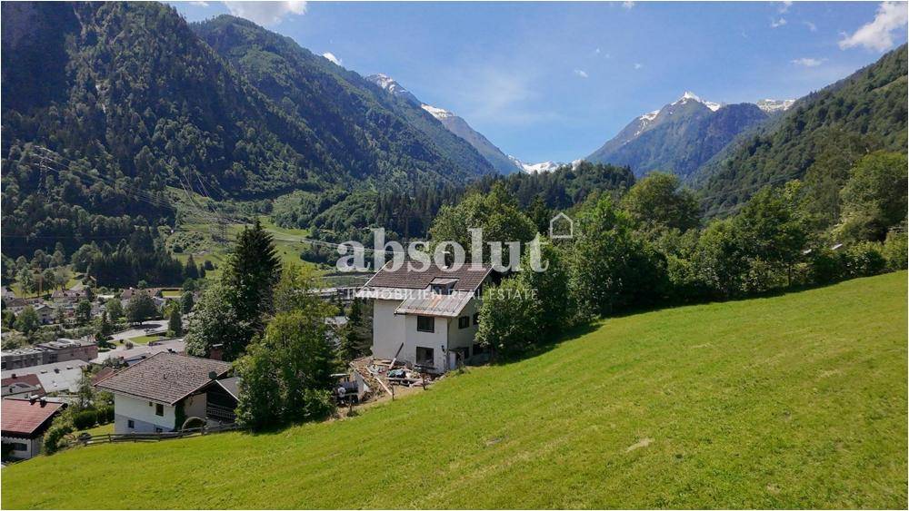 Voll erschlossenes Grundstück mit Altbestand in sonniger Hanglage von Kaprun. Entwicklungspotenzial! - Widok 2