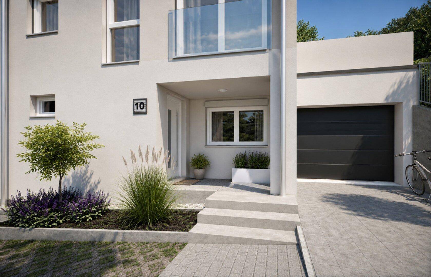 Eingangsbereich eines modernen Reihenhauses mit Garage, Treppe und kleiner Bepflanzung.