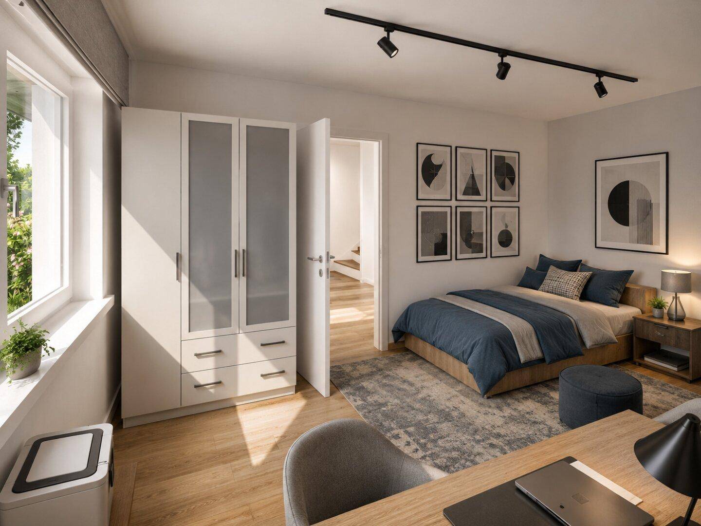 Schlafzimmer mit modernem Bett, Kleiderschrank und Blick auf die grüne Umgebung.