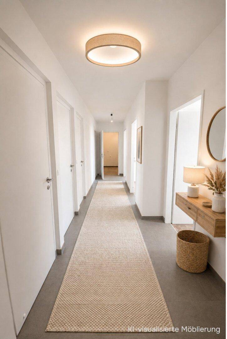Heller Flur mit modernem Deckenlicht, dunklem Fliesenboden und einer Holzkonsole.