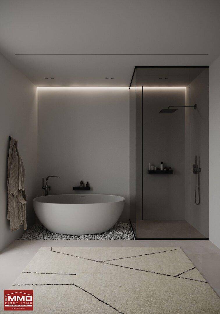 Elegantes Badezimmer mit freistehender Wanne, Glasdusche und minimalistischem Design.