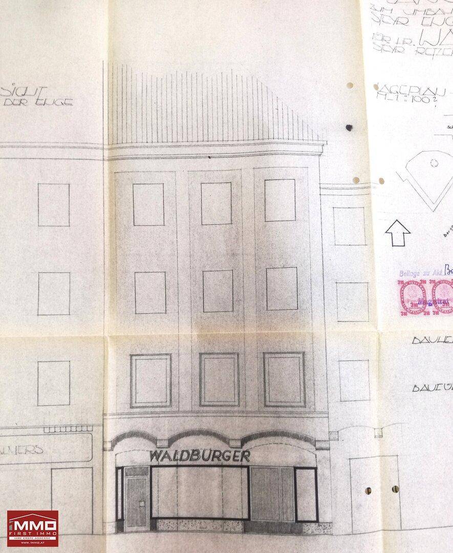 Detaillierte architektonische Zeichnung einer Gebäudefassade mit Ladenfront und dem Schriftzug 'WALDBURGER'.