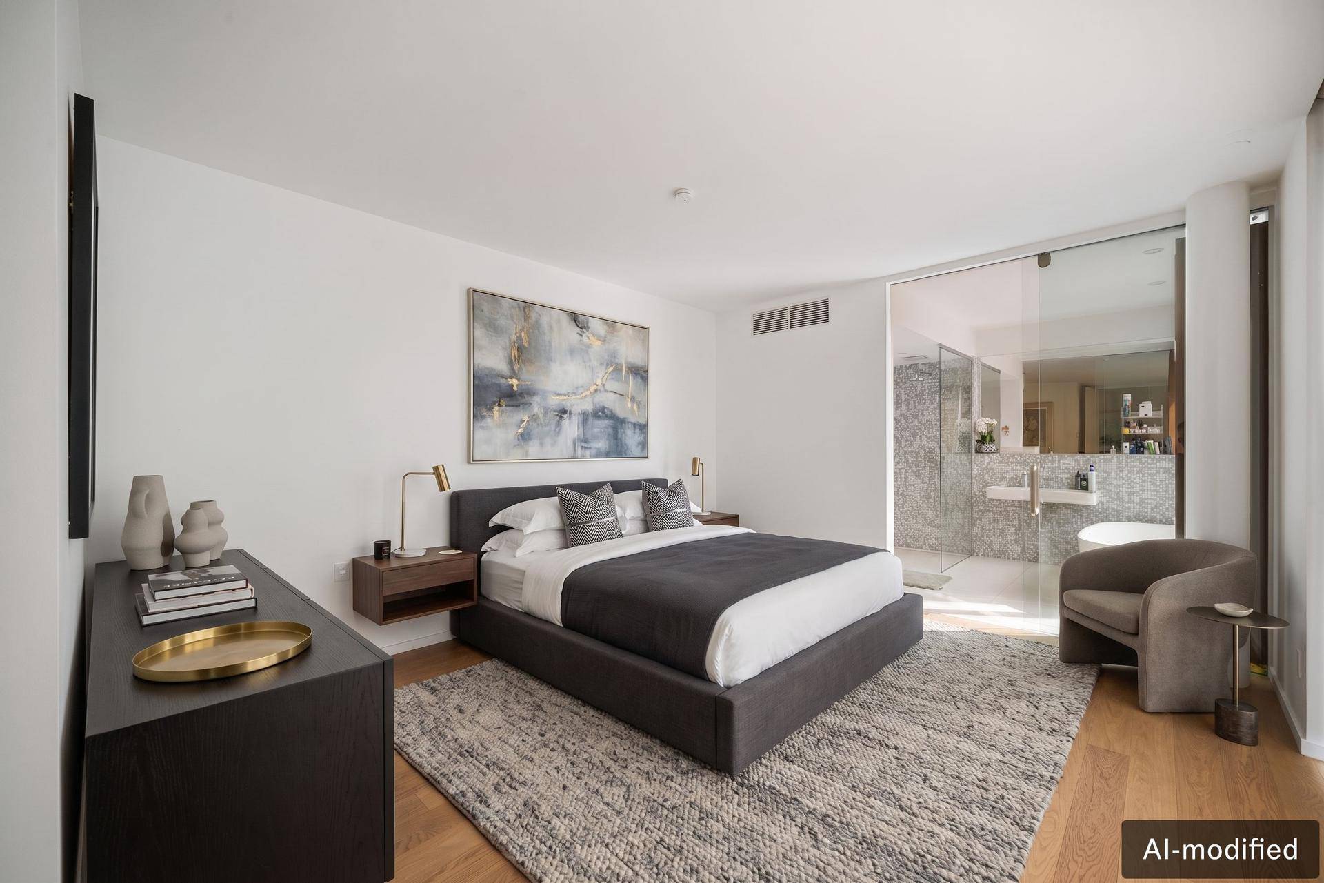 Modernes Schlafzimmer mit großem Bett, Holzboden und offenem Zugang zu einem luxuriösen Bad.