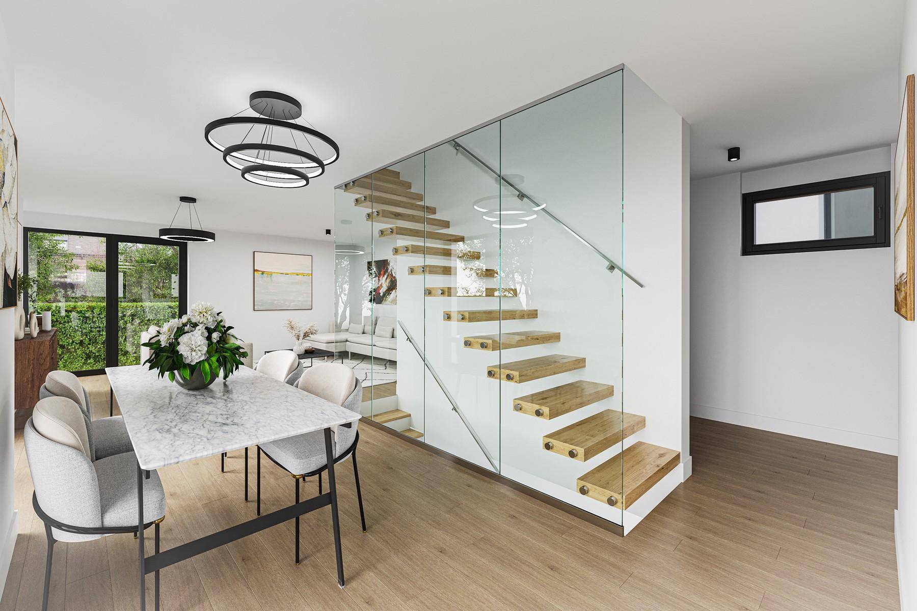 Heller offener Wohn- und Essbereich mit moderner Treppe und Holzboden.