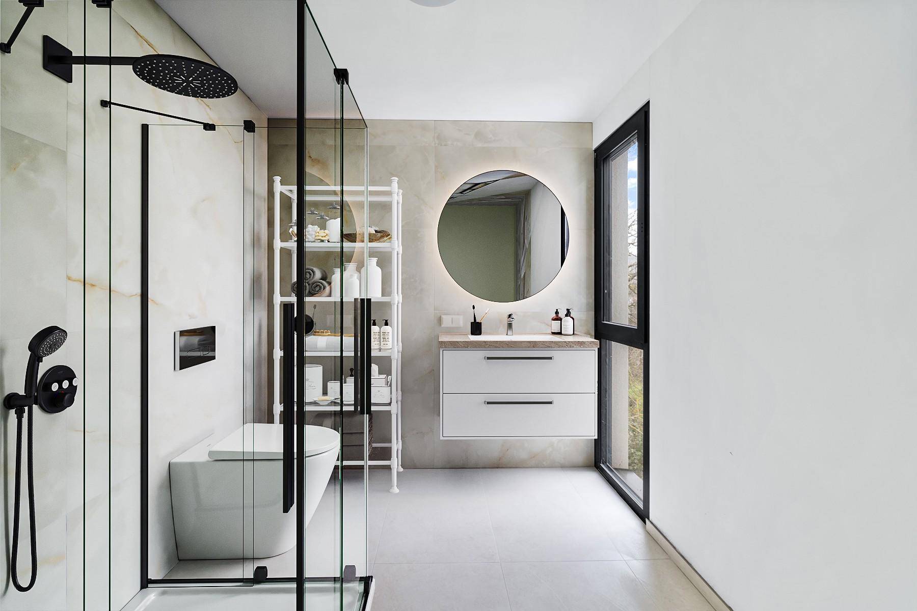 Modernes Badezimmer mit begehbarer Dusche, schwebendem Waschtisch und beleuchtetem Spiegel.