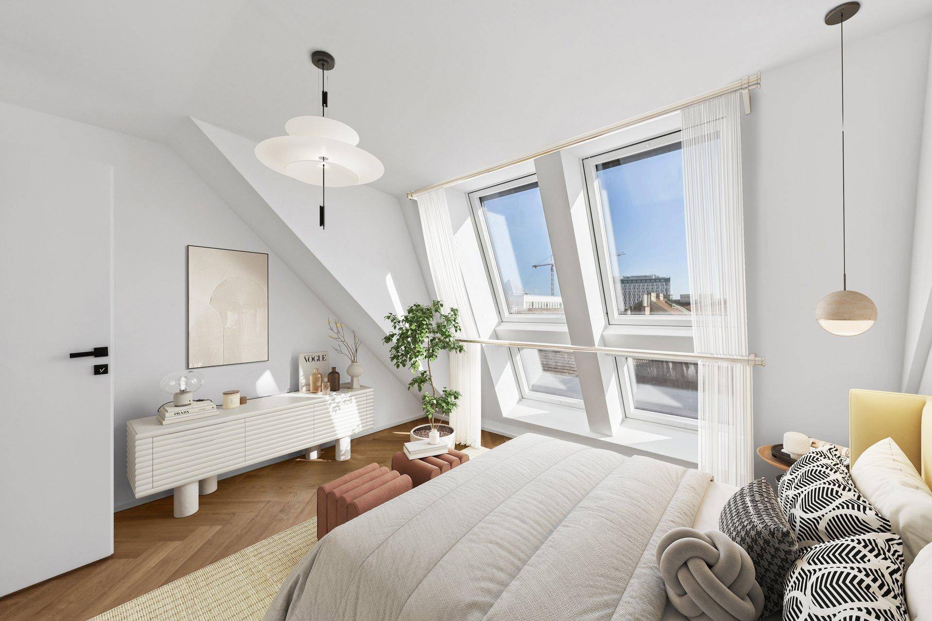 Helles Schlafzimmer im Dachgeschoss mit schrägen Wänden und großen Dachfenstern.