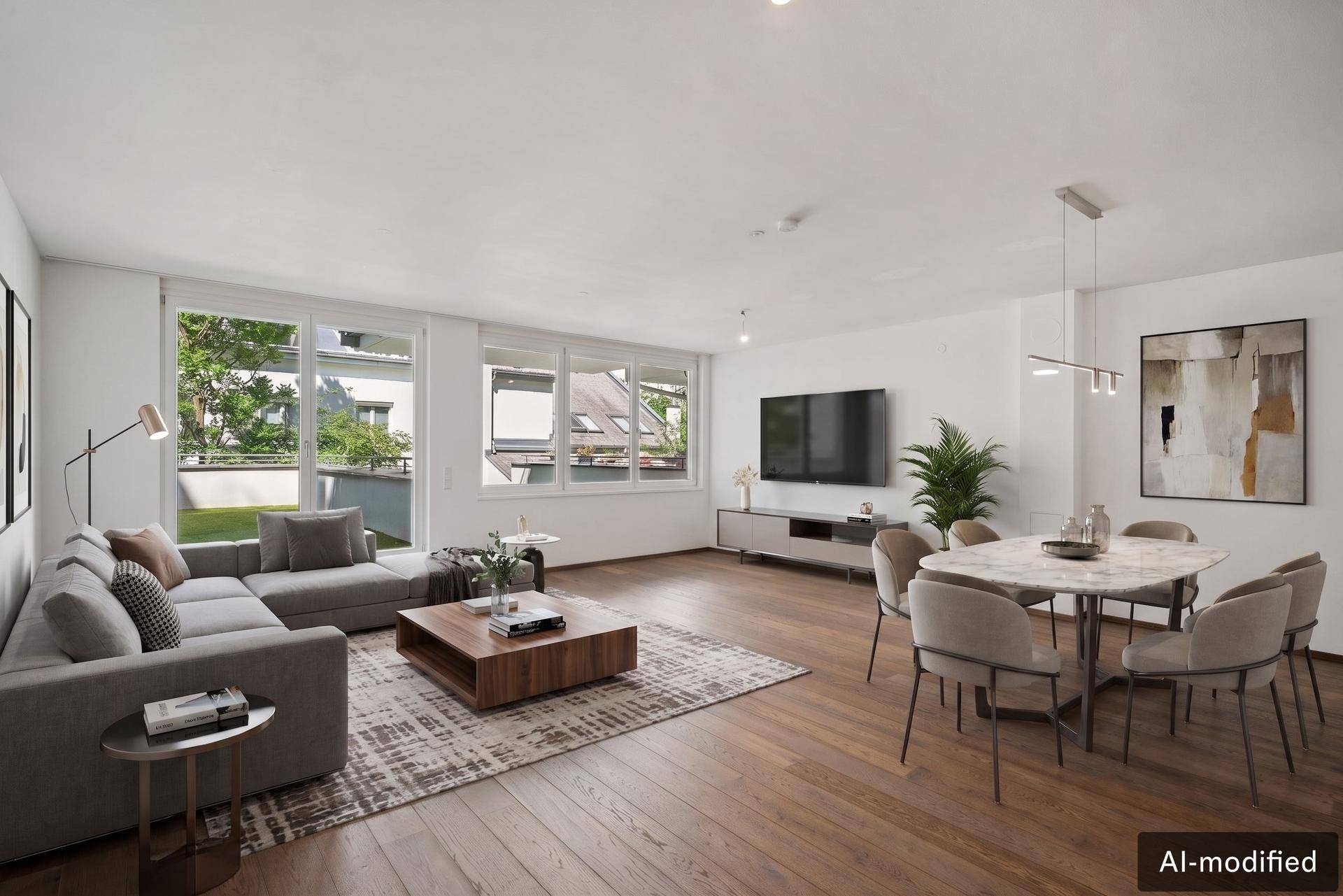 Modern eingerichteter Wohn-Essbereich mit Holzboden, bequemer Couch, Esstisch und Zugang zur Terrasse.