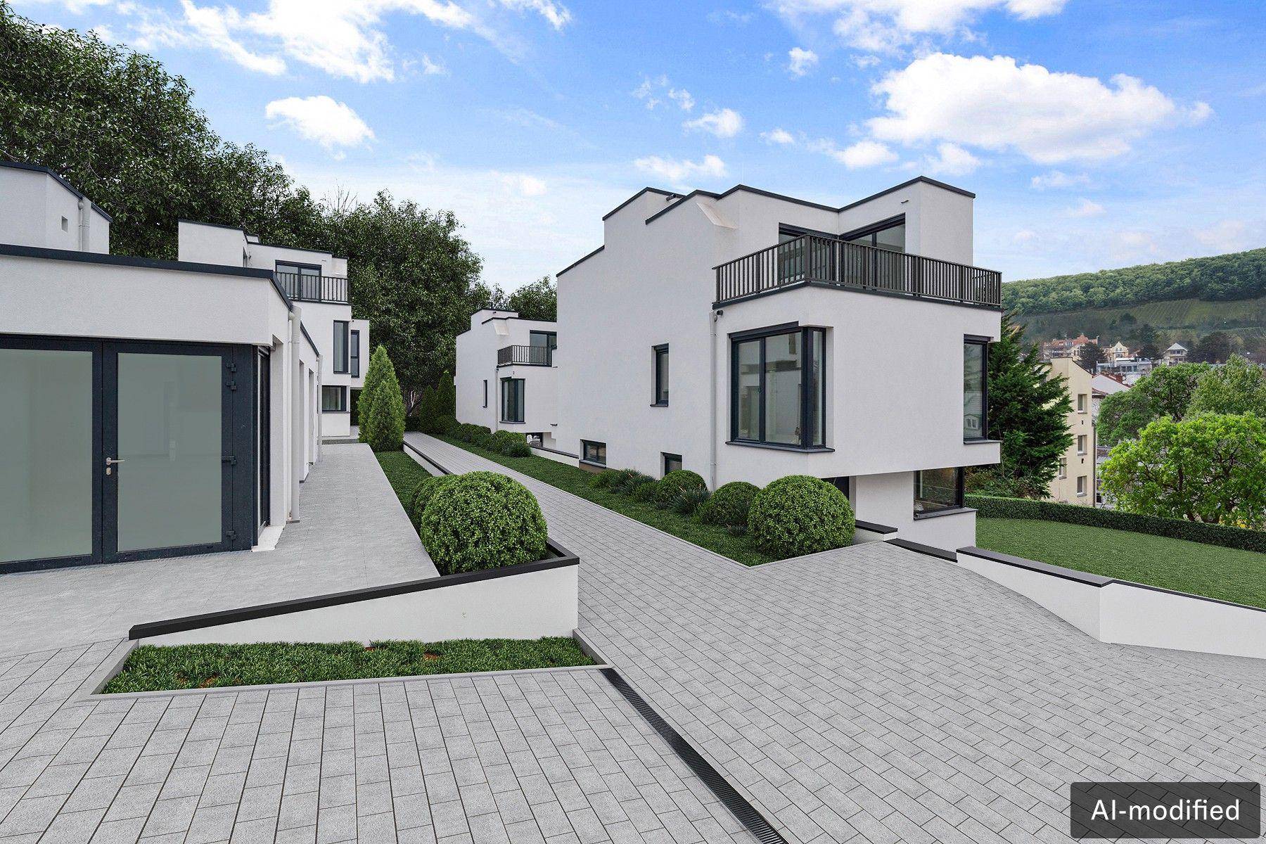 Zeitgenössische Architektur mit weißen Gebäuden, Balkonen und gepflegten Außenanlagen.
