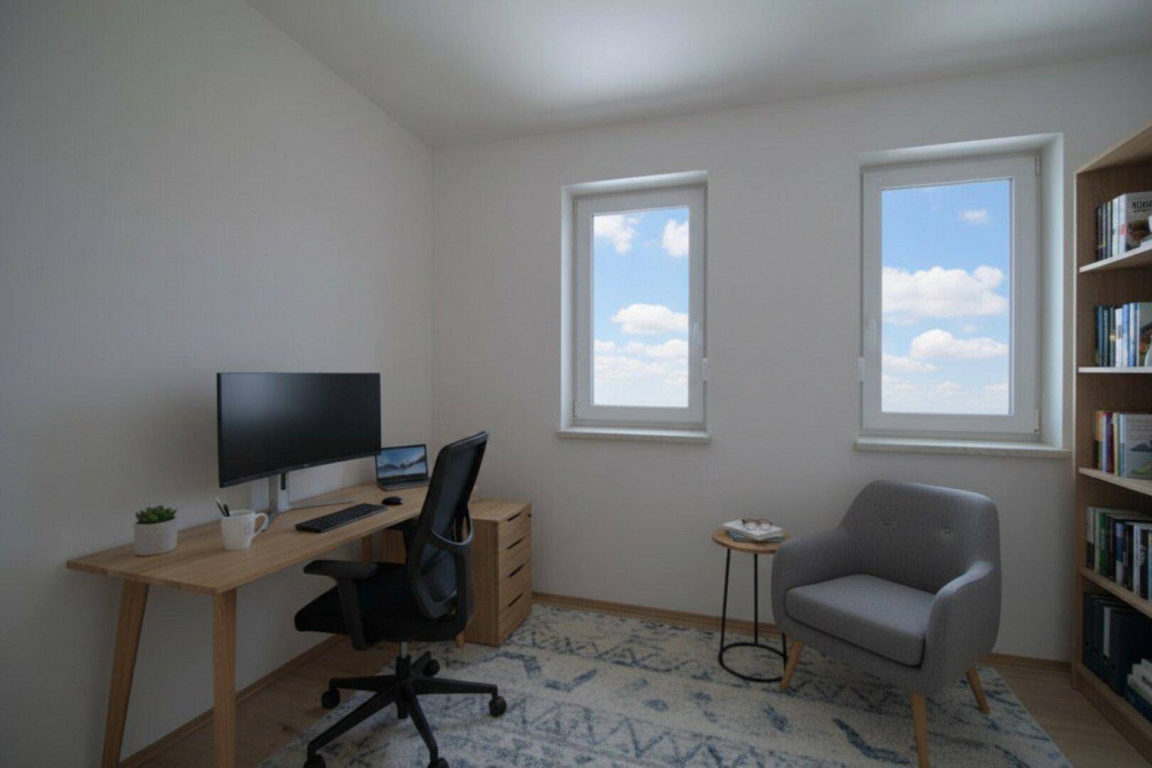 Helles Arbeitszimmer mit Schreibtisch, Bücherregal und Blick ins Grüne.