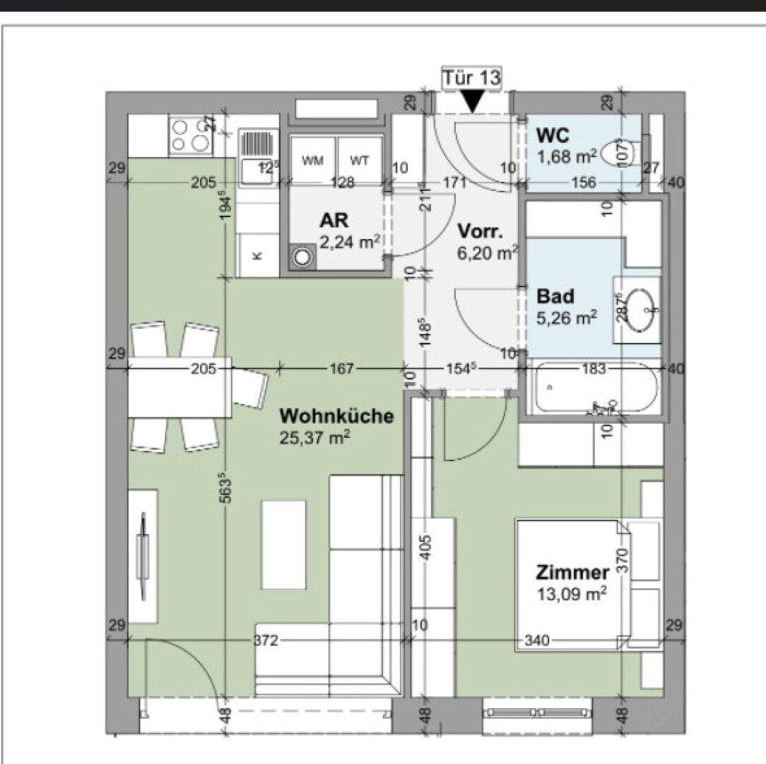 Detaillierter Grundriss einer Zweizimmerwohnung mit offener Wohnküche, Bad und separatem WC.