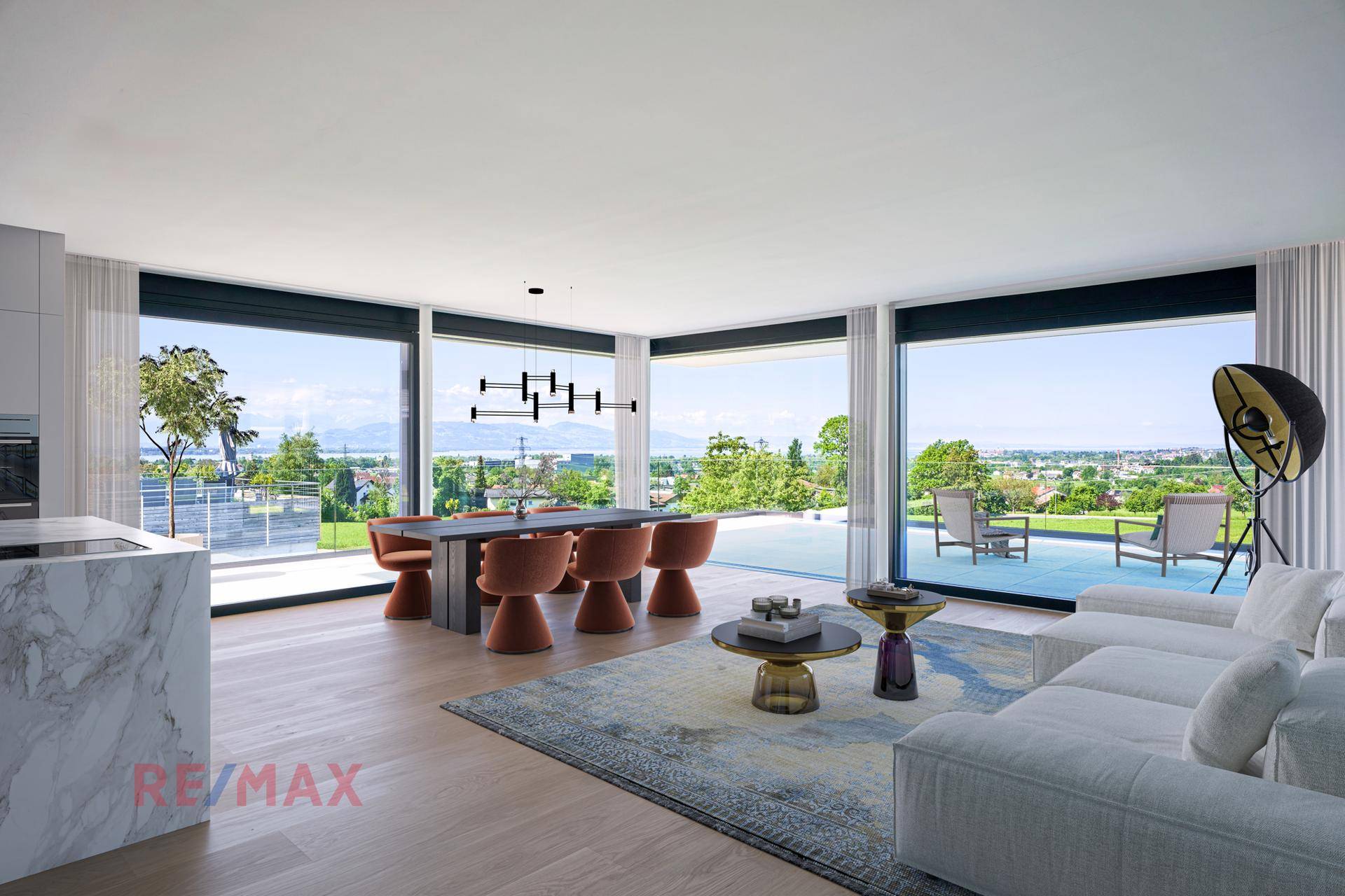 Modernes, offenes Wohn-Esszimmer mit großen Fenstern, Holzboden und weitem Ausblick.