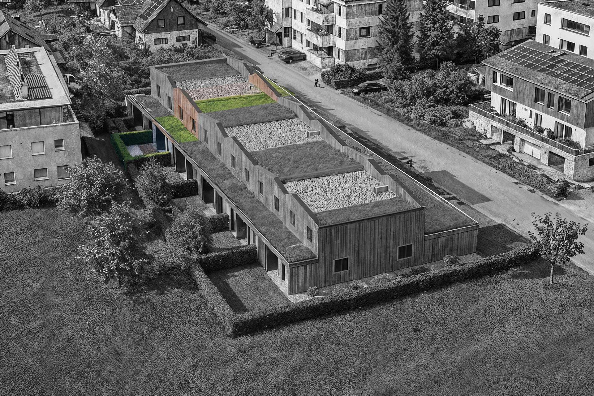 Luftaufnahme der modernen Reihenhäuser mit Flachdächern, begrünten Bereichen und Carports.
