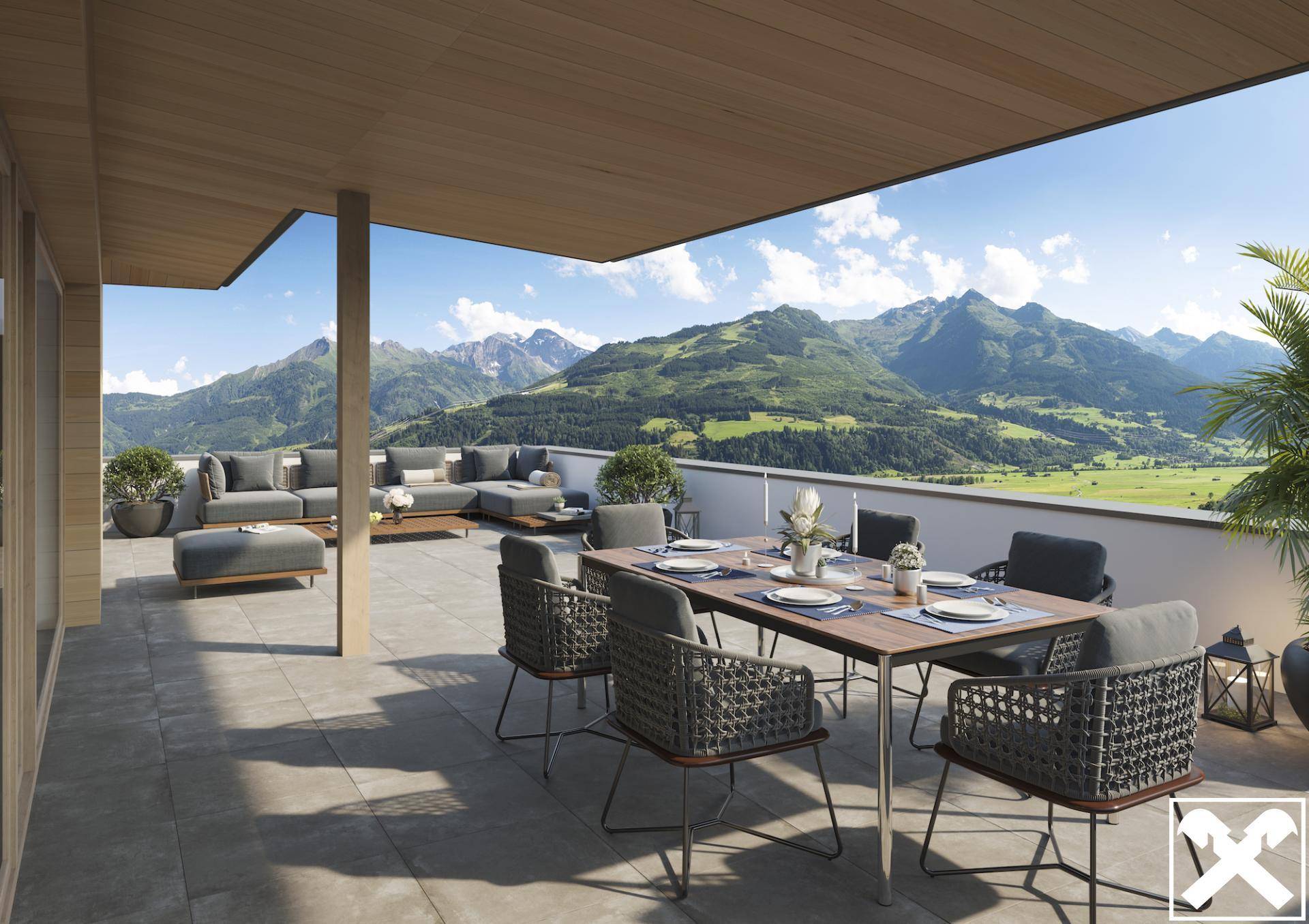 Geräumige Terrasse mit Ess- und Loungebereich, umgeben von einer atemberaubenden Berglandschaft.