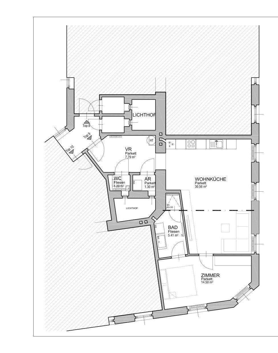 Grundriss einer Wohnung mit offener Wohnküche, separatem Schlafzimmer, Bad und Gäste-WC sowie einem Lichthof.