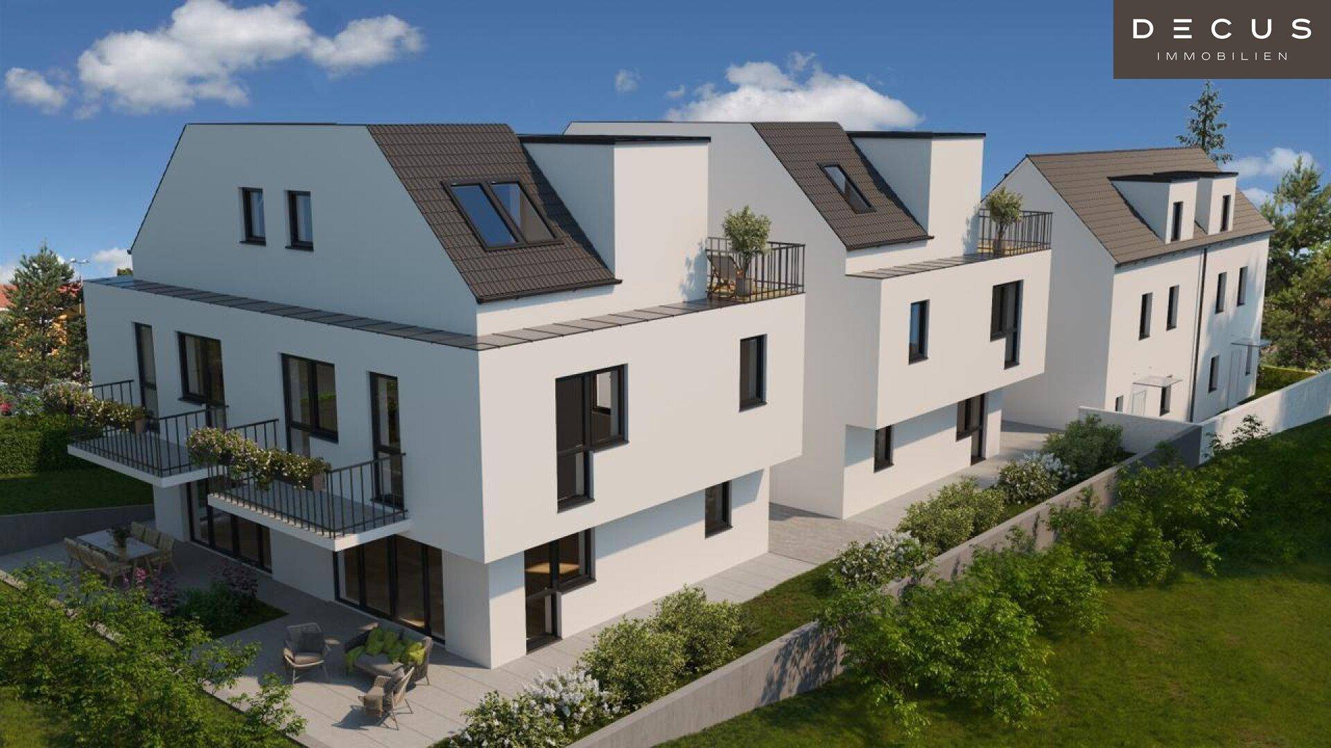 Ansicht einer modernen Wohnanlage mit klaren Linien, Balkonen und Terrassen in grüner Umgebung.