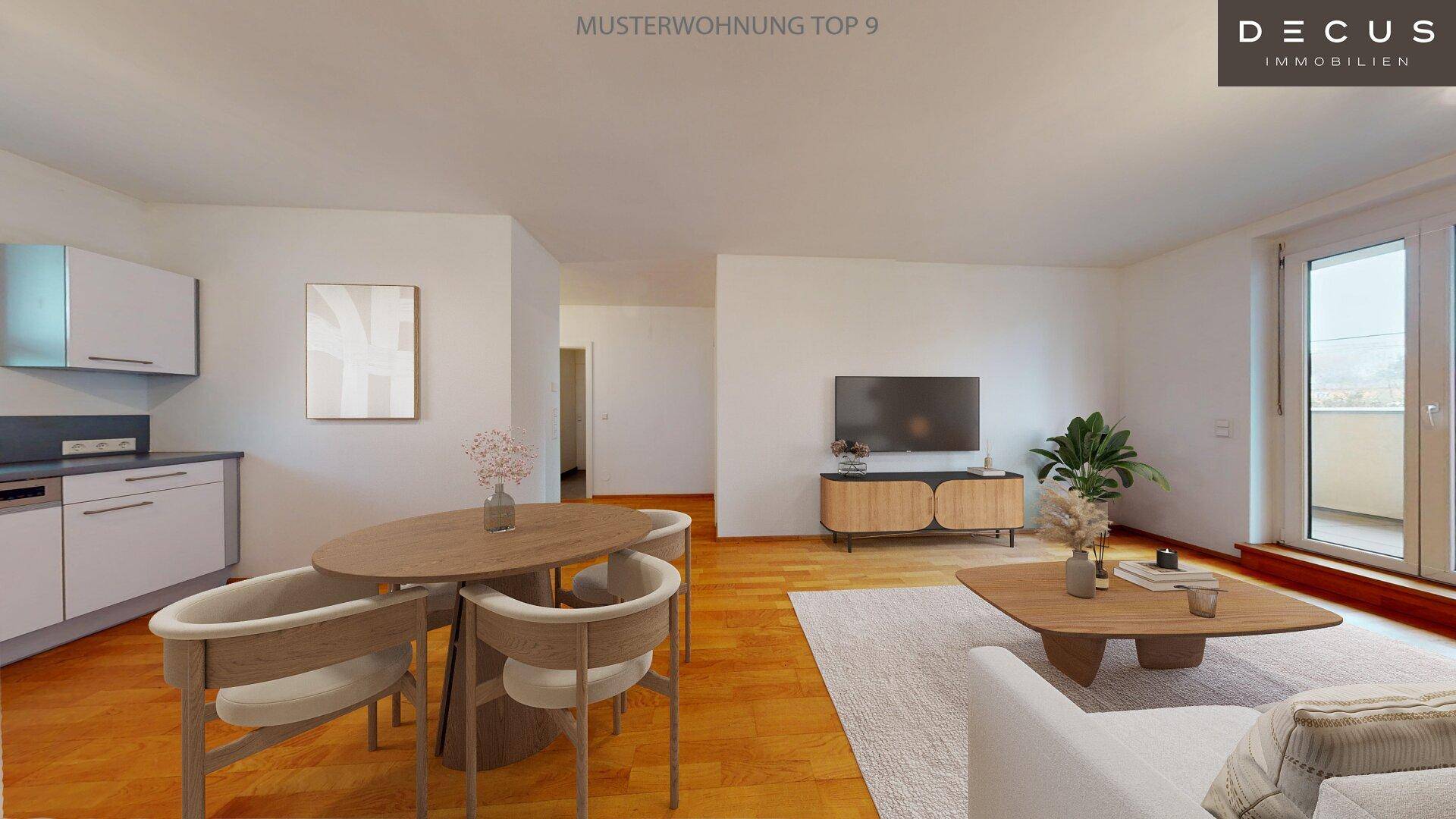 Offener Wohnbereich mit integrierter Küche, Essplatz und gemütlicher Sofaecke auf Holzboden.