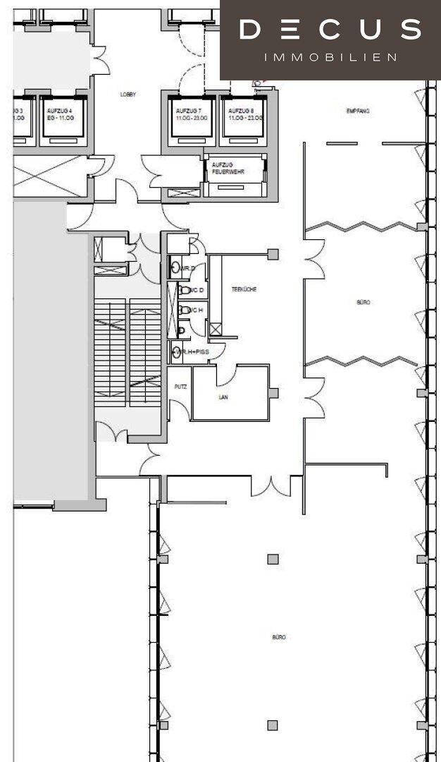 Grundriss einer Büroetage mit offenem Layout, Aufzügen und Sanitärbereichen.