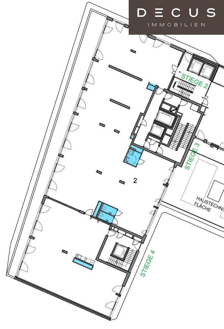 Ausschnitt eines Grundrisses mit Treppenhäusern, Aufzügen und großen, offenen Büroflächen.