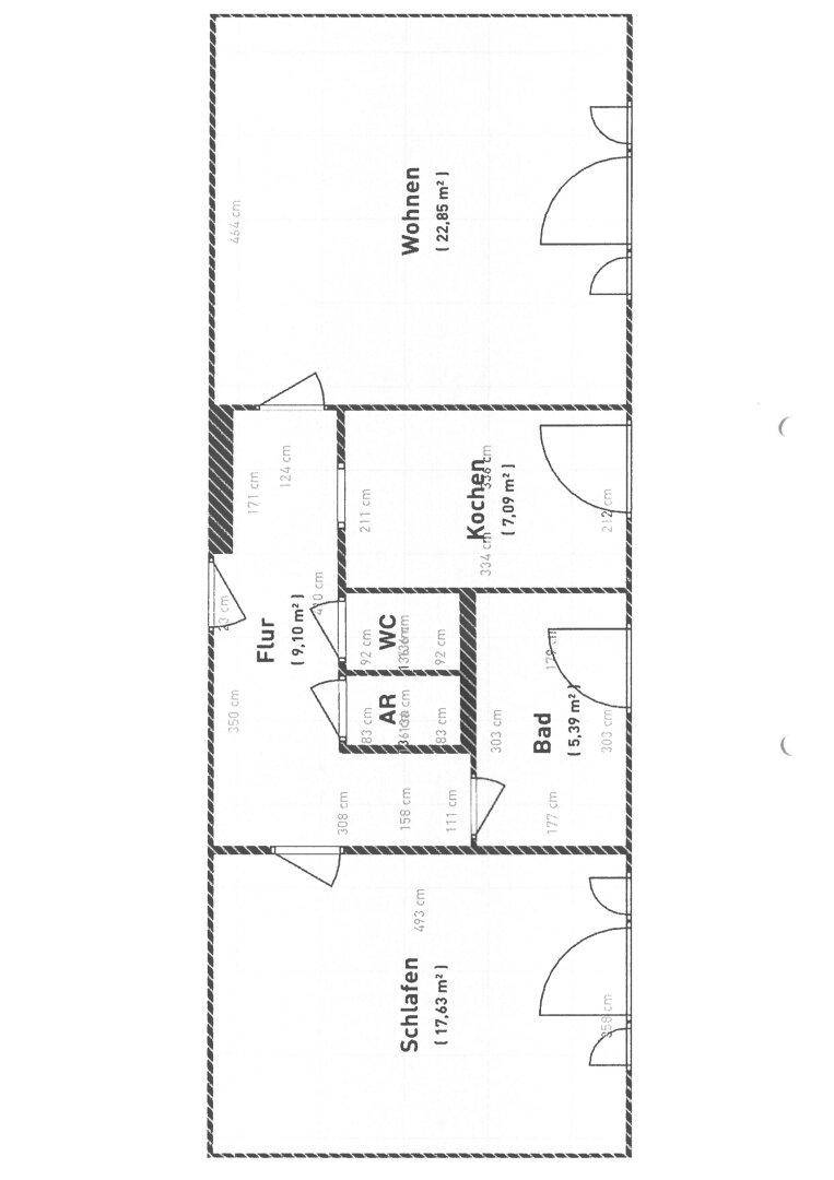 Grundriss der Wohnung mit separatem Wohnzimmer, Küche, Schlafzimmer, Bad und WC sowie Balkonzugang.