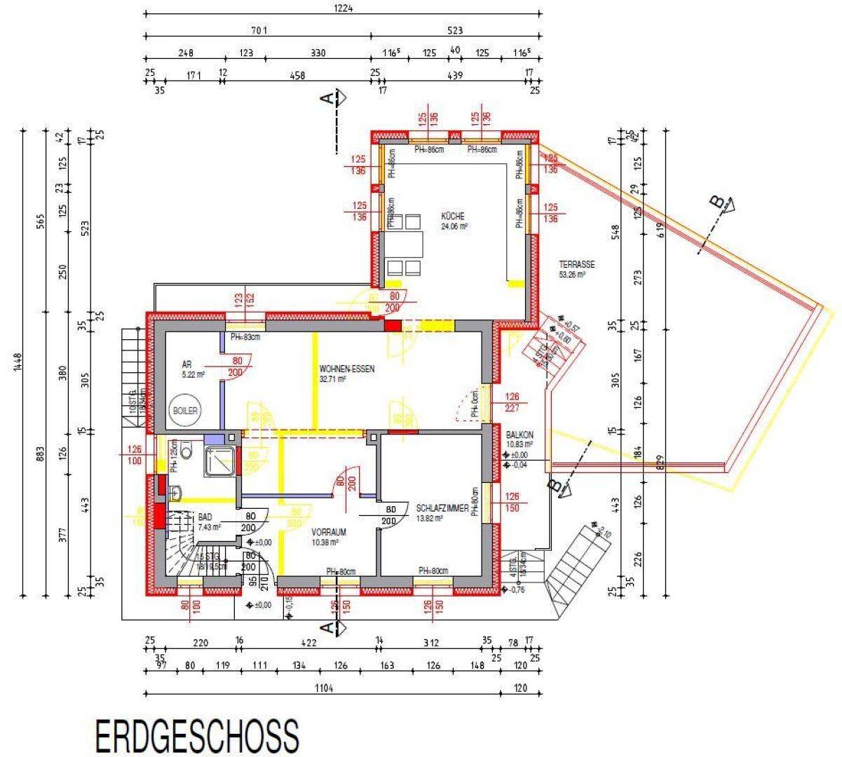 Grundriss des Erdgeschosses mit offenem Wohn-Essbereich, Küche, Schlafzimmer und Balkon.