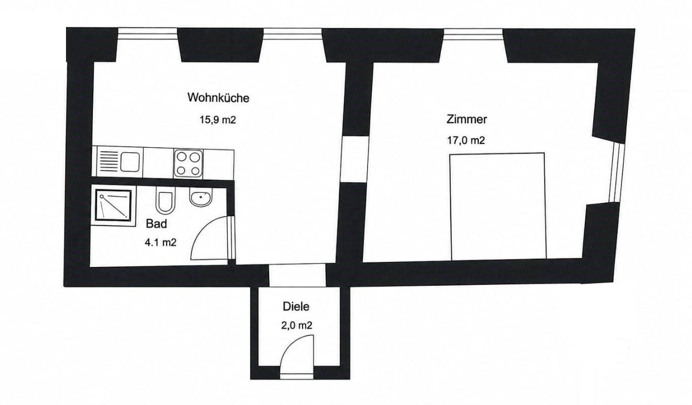 Grundriss einer Wohnung mit Wohnküche, Zimmer, Bad und Diele.