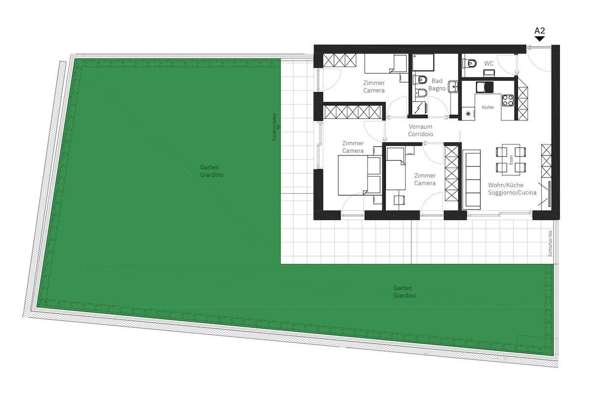 Grundriss einer Erdgeschosswohnung mit Garten, drei Zimmern und offenem Wohnbereich.